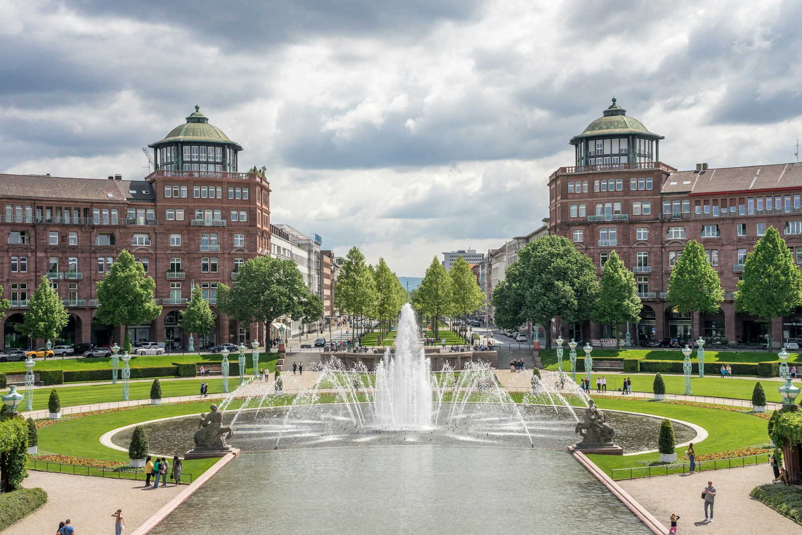 a view of a fountain in the middle of a park