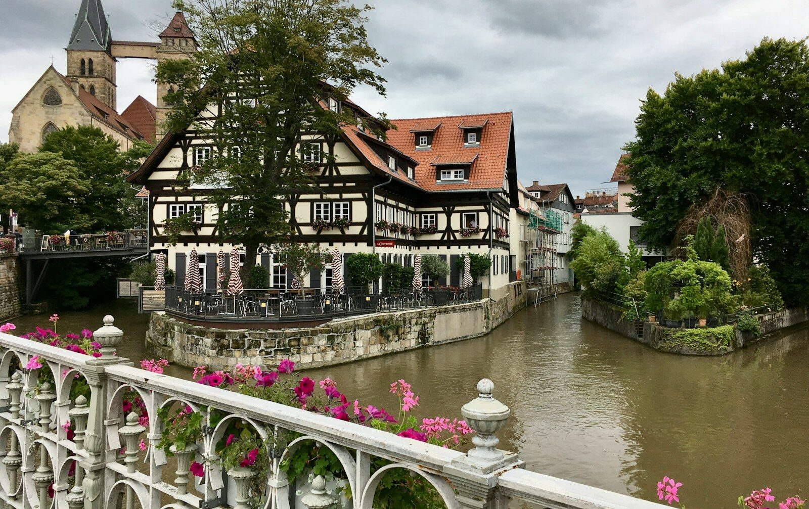 a river running through a city next to tall buildings